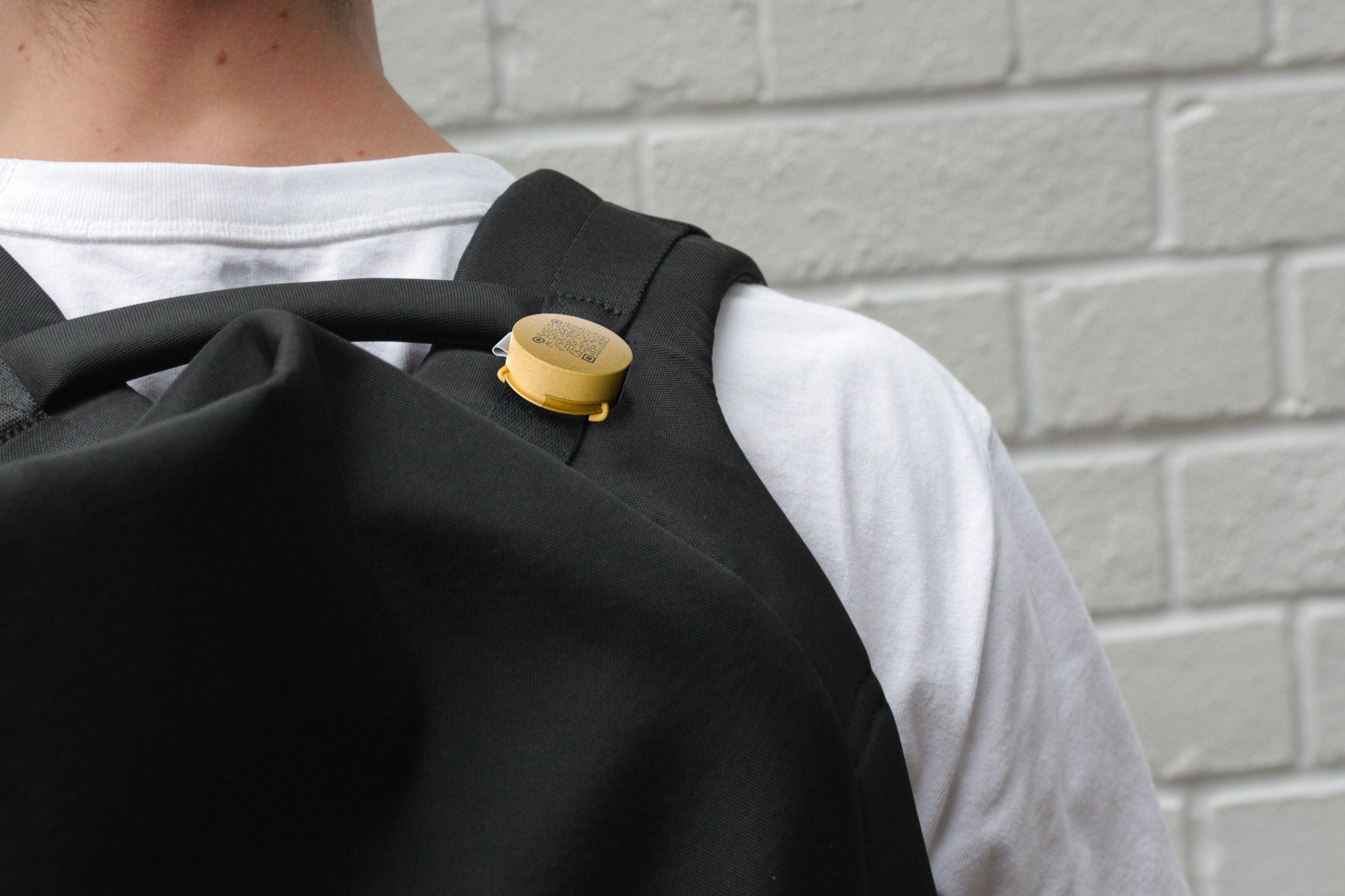 Roam Tag attached to a child’s backpack to prevent lost school items